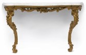 A Louis XV carved giltwood con