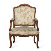 A LOUIS XV CARVED WALNUT FAUTE