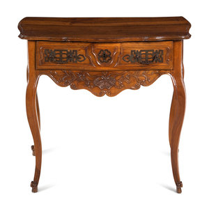 A Louis XV Provincial Carved Walnut