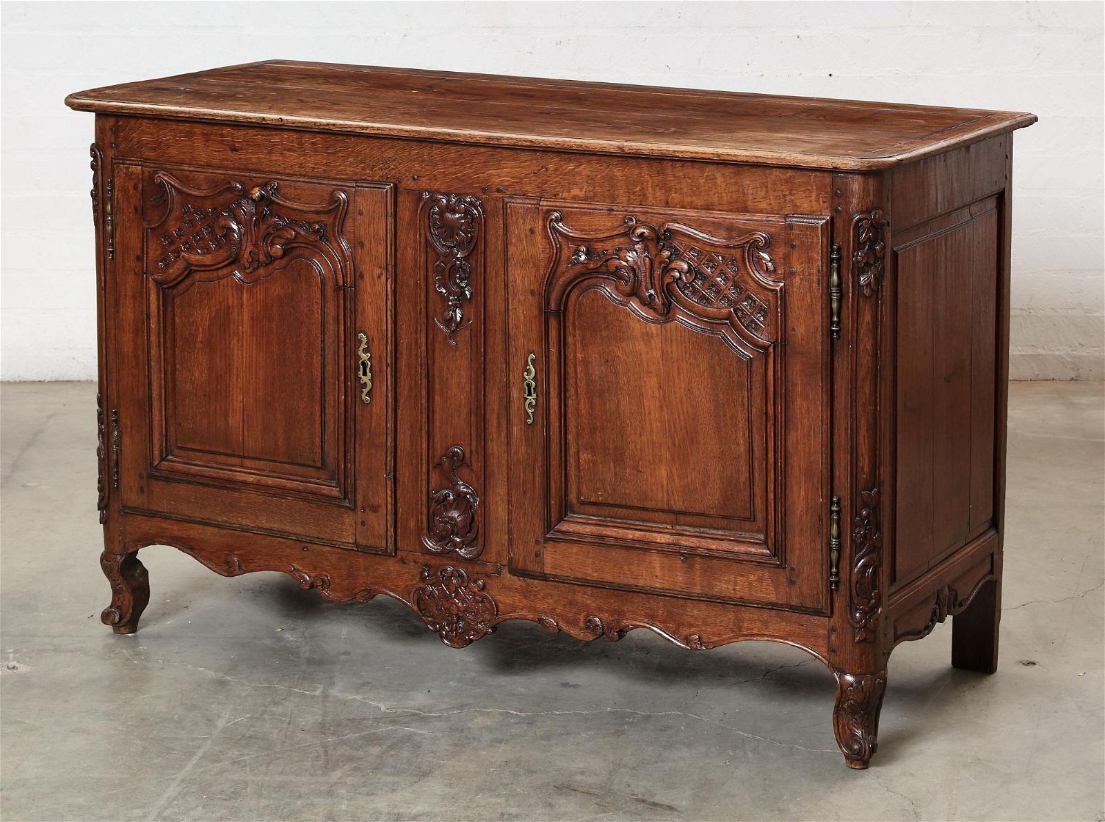 A LOUIS XV PROVINCIAL OAK BUFFETA