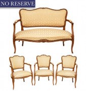 A LOUIS XV-STYLE CARVED WALNUT