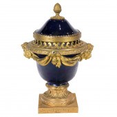 A LOUIS XV STYLE GILT BRONZE M
