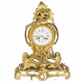A LOUIS XV STYLE GILT BRONZE M