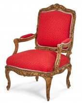 A LOUIS XV STYLE GILTWOOD ARMC