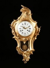 A LOUIS XV STYLE ORMOLU CARTEL