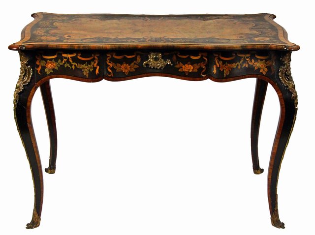 A Louis XV style walnut and