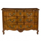 A LOUIS XV WALNUT COMMODE EN A