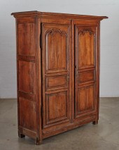 A LOUIS XVI PROVINCIAL OAK ARM