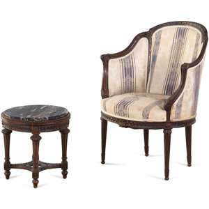A Louis XVI Style Carved Walnut