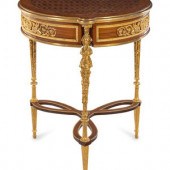 A Louis XVI Style Gilt Metal M
