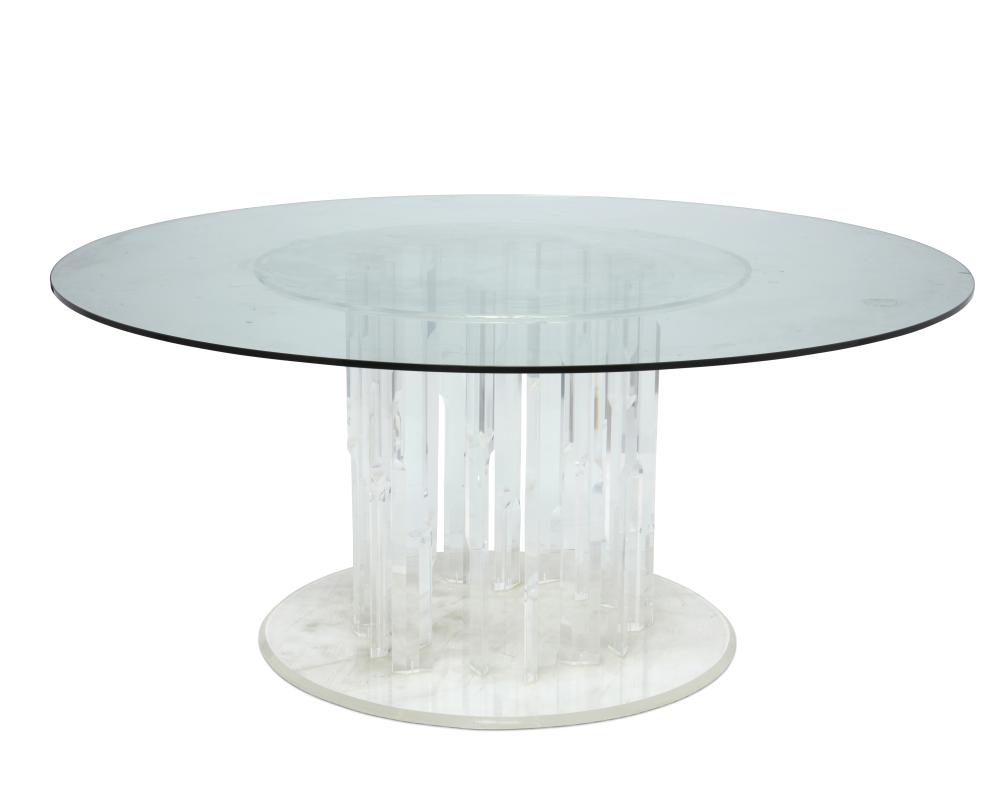 A LUCITE PEDESTAL DINING TABLEA