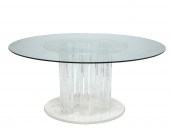 A LUCITE PEDESTAL DINING TABLE
