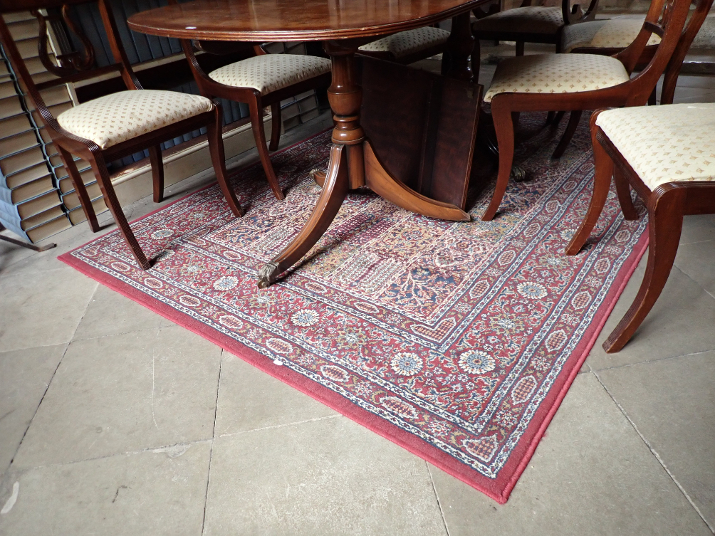 A MACHINE MADE RUG OF PERSIAN