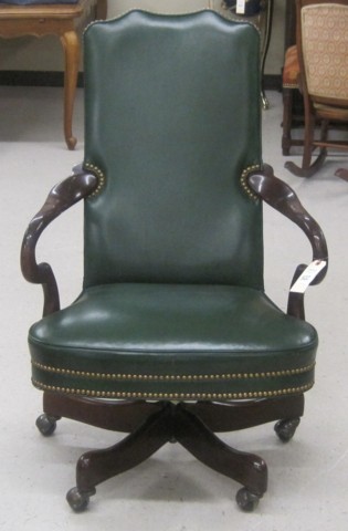 A MAHOGANY AND GREEN LEATHER SWIVEL