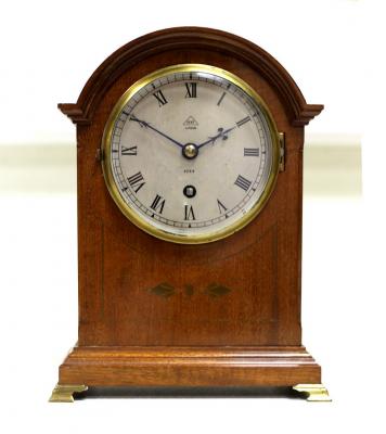 A mahogany arched mantel clock,