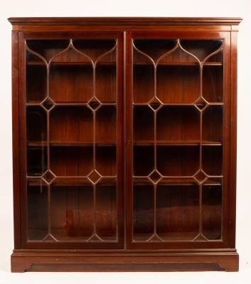 A mahogany bookcase on bracket