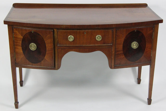 A mahogany bowfront sideboard