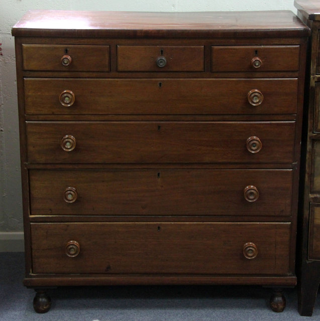 A mahogany chest of four long and