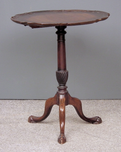 A mahogany circular tripod table of