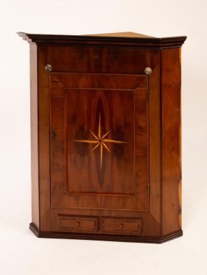 A mahogany corner cupboard,
