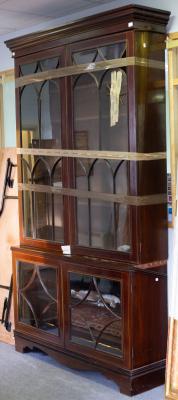 A mahogany display cabinet, in