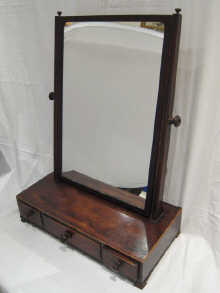 A mahogany dressing table mirror