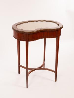 A mahogany kidney-shaped display