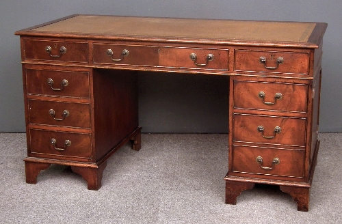 A mahogany kneehole desk of