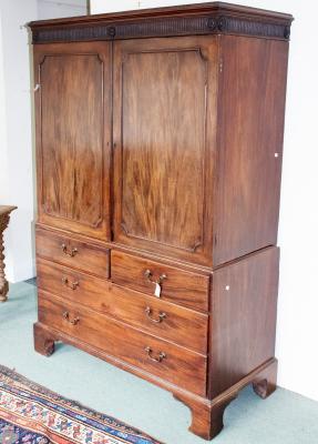A mahogany linen press fitted