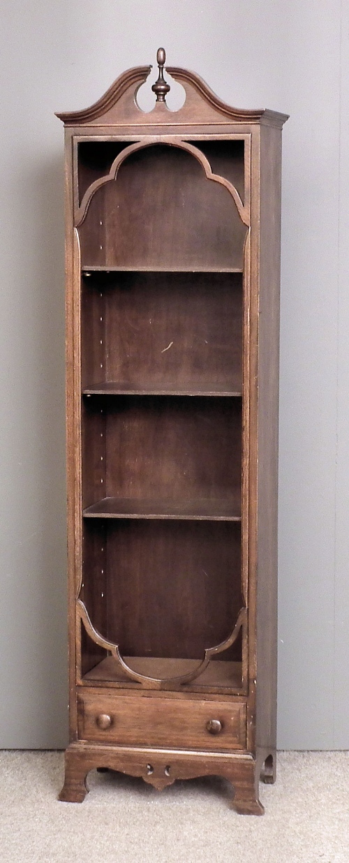 A mahogany open front bookcase of