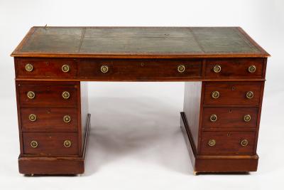 A mahogany pedestal desk fitted a
