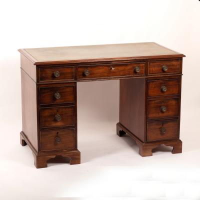 A mahogany pedestal desk, the green