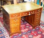 A mahogany pedestal desk, the
