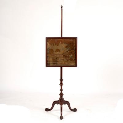 A mahogany pole screen with vase