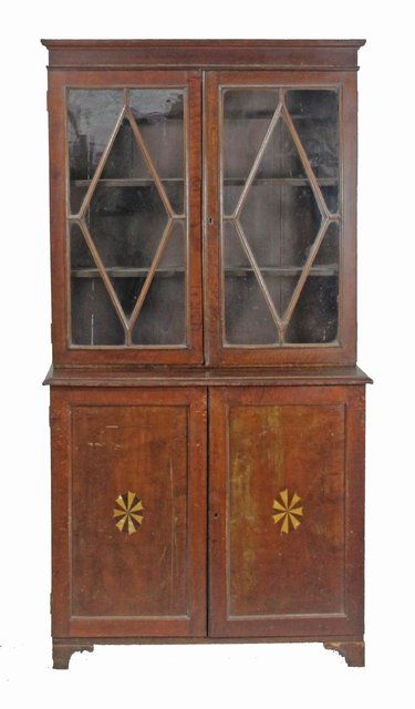 A mahogany side cabinet the twin