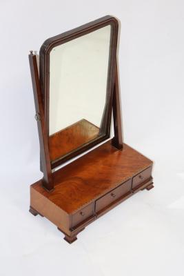 A mahogany swing frame dressing
