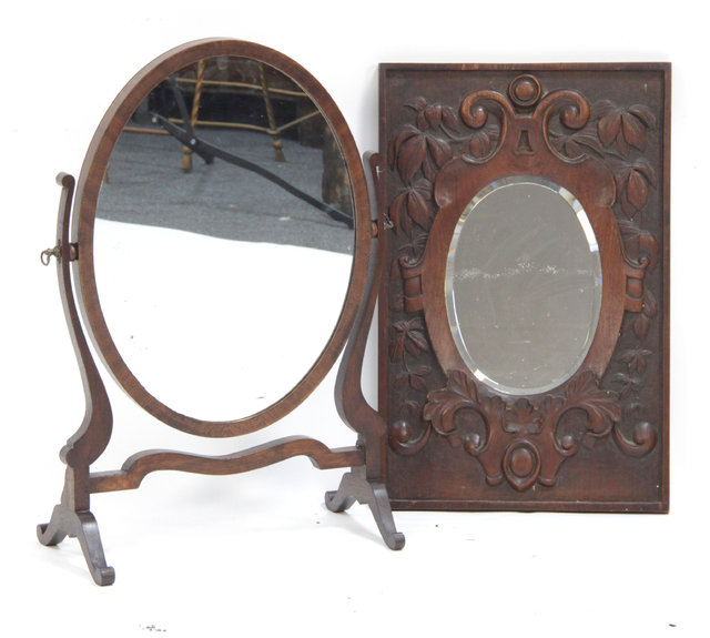 A mahogany swing frame mirror and a
