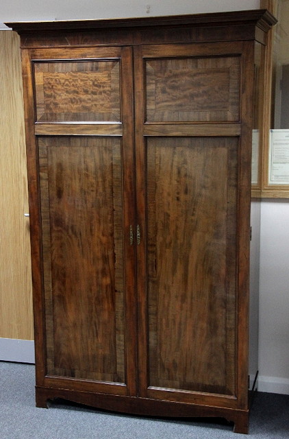 A mahogany two-door hall cupboard