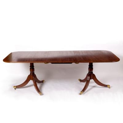 A mahogany two-pillar dining