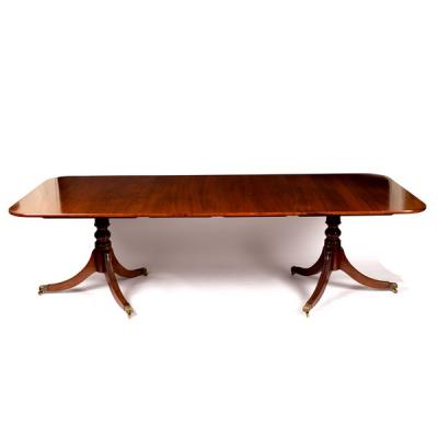 A mahogany two-pillar dining table,