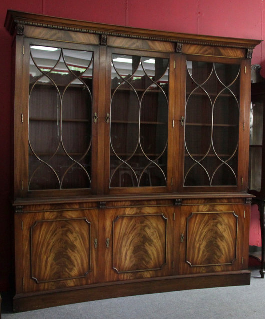 A mahogany veneered concave
