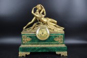 A MALACHITE CLOCK WITH A GILT
