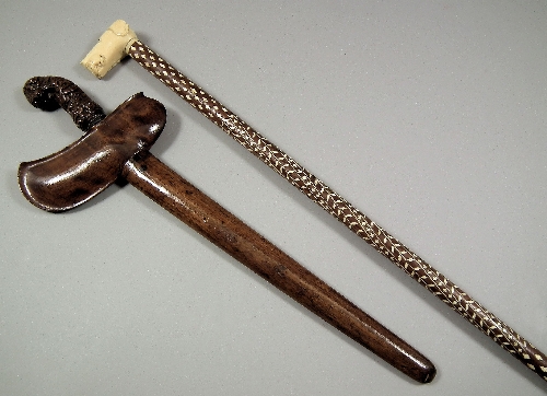 A Malaysian Kris with carved wood