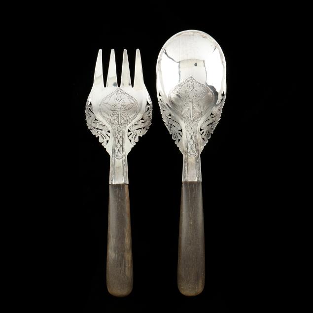 A MALAYSIAN SILVER SERVING FORK AND