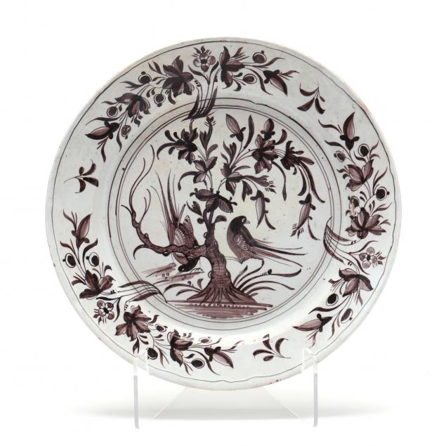 A MANGANESE DECORATED FAIENCE