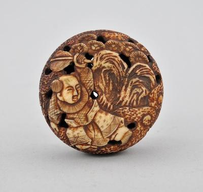 A Manju Netsuke Carved bone of