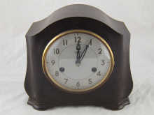 A mantel clock by Smiths in a