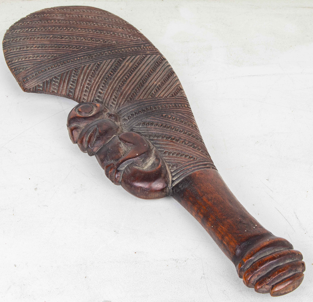 A MAORI CLUB (PATU) CARVED AS A