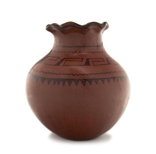 A Maricopa Redware Olla having a