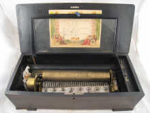 A marquetry inlaid rosewood musical
